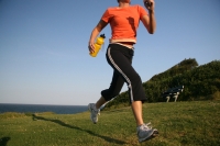 Woman running up a hill